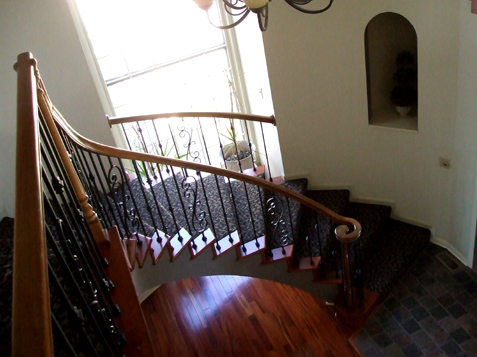 Iron Spindles and Wood End Caps enhance any Stairway